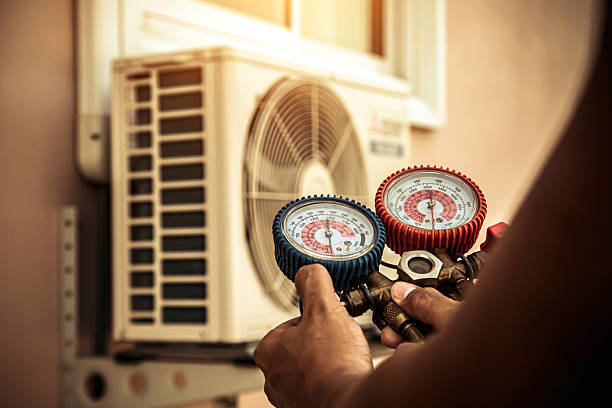 Professional Air Conditioning Service technician working in Finksburg, MD
